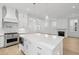 Eat-in kitchen island has stainless appliances, modern vent hood, and pendant lighting at 9017 Stern Aly, Johns Island, SC 29455