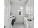 Well-equipped laundry room with appliances, storage cabinets, and ample counter space at 9017 Stern Aly, Johns Island, SC 29455
