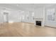 Spacious living room with a fireplace and hardwood floors with ample light and easy access to other areas at 9017 Stern Aly, Johns Island, SC 29455