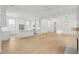 A living area that flows into a kitchen with quartz countertops and stainless appliances at 9017 Stern Aly, Johns Island, SC 29455