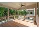 Relaxing covered porch featuring a ceiling fan and backyard views at 9017 Stern Aly, Johns Island, SC 29455