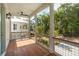 Inviting screened-in porch with wood flooring, ceiling fan, and outdoor view at 9017 Stern Aly, Johns Island, SC 29455