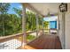 Inviting screened-in porch with wood flooring, ceiling fan, and nature view at 9017 Stern Aly, Johns Island, SC 29455