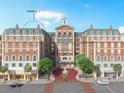 Brick building with arched entry, balconies, and fountain at 609 King St # 607, Charleston, SC 29403