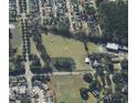 Aerial view of property with pond, located near residential area at 1501 Central Ave, Summerville, SC 29483