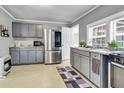 Gray kitchen with stainless steel appliances and granite countertops at 8375 Shell House Rd, Edisto Island, SC 29438