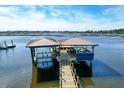 Waterfront property with a covered boat house and dock at 633 Barbados Dr, Charleston, SC 29492