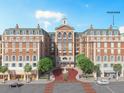 Brick building with arched entryway and fountain in front at 609 King St # 747, Charleston, SC 29403