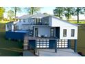 Modern two-story home with attached garage and elevated deck at 35 W 9Th Street Ext, Folly Beach, SC 29439