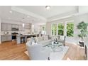 Open concept living room with hardwood floors and neutral decor at 418 Queenview Ln, Charleston, SC 29414