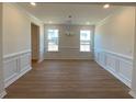 Dining room featuring chair rail molding and decorative lighting at 502 Fiskdale Cir, Summerville, SC 29486