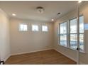 Bright living room featuring hardwood floors and large windows for natural light at 502 Fiskdale Cir, Summerville, SC 29486