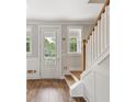 Front entry with hardwood floors and staircase at 1639 Cultivation Ln # 449, Mount Pleasant, SC 29466