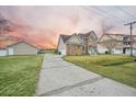 Two-story house with stone accents and a teal front door, driveway view at 1713 Pimlico Blvd, Moncks Corner, SC 29461