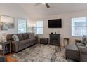 Spacious living room with grey sofa and a large TV at 2 Pelican Reach # Share 10, Isle of Palms, SC 29451