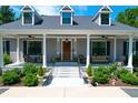 Gray house with front porch and landscaping at 769 Bulls Bay Blvd, Awendaw, SC 29429