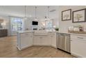 Bright kitchen features a large island with a farmhouse sink and stainless steel appliances at 113 O'Leary Circle, Summerville, SC 29483