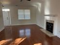 Bright living room with hardwood floors, fireplace, and access to the front door at 170 Willowbend Ln, Summerville, SC 29485