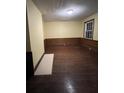 Spacious bedroom with hardwood floors and wood paneling at 2 Ducs Ct, Charleston, SC 29403