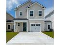 Charming two-story home with a manicured lawn and a private driveway and attached one car garage at 346 Chapman Cir, Goose Creek, SC 29445