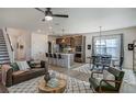 Open concept living space with a modern kitchen, dining area, and cozy living room with great flow at 144 Seaton Street, Summerville, SC 29486