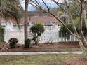 Community pool with white vinyl fence and surrounding landscaping at 110 Pinewood St # C, Ladson, SC 29456