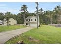 Two-story house with driveway, and green lawn at 1625 Pimlico Blvd, Moncks Corner, SC 29461