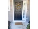 Inviting front door entrance with a wreath and welcome mat at 1005 Washitonia # C, Charleston, SC 29492