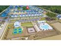 Aerial view of community with pool, playground, and tennis courts at 1016 Swamp Harrier Ave, Ravenel, SC 29470