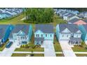 Aerial view of a neighborhood with houses and community amenities at 1016 Swamp Harrier Ave, Ravenel, SC 29470