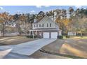 Two-story house with brick and siding, two-car garage, and a porch at 1401 Churchill Rd, Moncks Corner, SC 29461