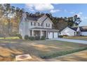 Two-story house with brick and siding, two-car garage, and a porch at 1401 Churchill Rd, Moncks Corner, SC 29461
