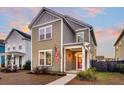 Two-story Craftsman home with charming front porch and landscaped yard at 207 Billinger St, Summerville, SC 29486