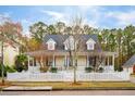 Two-story home with a wrap-around porch and landscaped yard at 2524 Willbrook Ln, Mount Pleasant, SC 29466