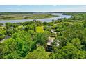 Aerial view showcasing home's waterfront location near marsh and river at 4858 Marshwood Dr, Hollywood, SC 29449