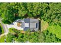 Bird's-eye view of a house nestled in a lush green forest setting at 4858 Marshwood Dr, Hollywood, SC 29449