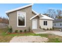 Two-toned modern home with a unique architectural style and well-manicured landscaping at 5344 Sea Watch Lane, North Charleston, SC 29406