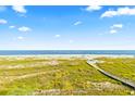 Beachfront property with boardwalk leading to ocean at 7000 Palmetto Dr # 12E, Isle of Palms, SC 29451