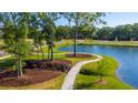 Aerial view of a community with a pond and walking paths at Cir, Mount Pleasant, SC 29464