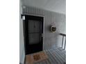 Inviting condo entry with black door and a welcome mat at 1158 Village Creek Lane Unit 4 # 803, Mount Pleasant, SC 29464