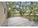Spacious back deck overlooks a tranquil backyard with lush greenery at 538 River Rd, Johns Island, SC 29455