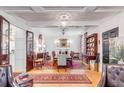 Bright dining room with hardwood floors, chandelier, and antique furnishings at 79 Alexander St, Charleston, SC 29403