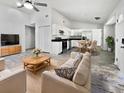Open living room and kitchen with modern appliances and flooring at 110 Manchester Rd, Summerville, SC 29486