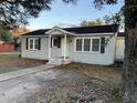 Newly painted gray brick ranch home with a light green front door and walkway at 114 Groves St, Walterboro, SC 29488