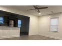 Bright living room with hardwood floors and an open concept kitchen at 114 Groves St, Walterboro, SC 29488