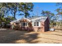 Charming brick home with a spacious yard and mature trees at 1216 Taliaferro Ave, Charleston, SC 29412