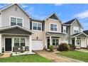Row of townhomes showcasing a variety of exterior finishes and landscaping at 162 Kirkland St, Goose Creek, SC 29445