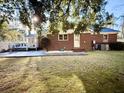 Brick house with deck, patio, and spacious backyard at 201 Center St, Walterboro, SC 29488