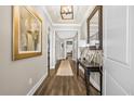 Bright entry hall with hardwood floors and elegant décor at 218 River Martin Ct, Summerville, SC 29483