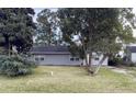 Gray house with a yard and trees at 2351 Elegans Dr, North Charleston, SC 29405